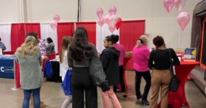 staff talking to job seekers at a local job fair