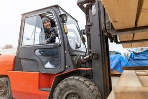 Forklift Driver loading materials for shipping to customers