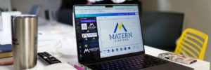 Laptop showing logo for Matern blog