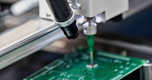 Production Worker using machines at a circuit board manufacturer
