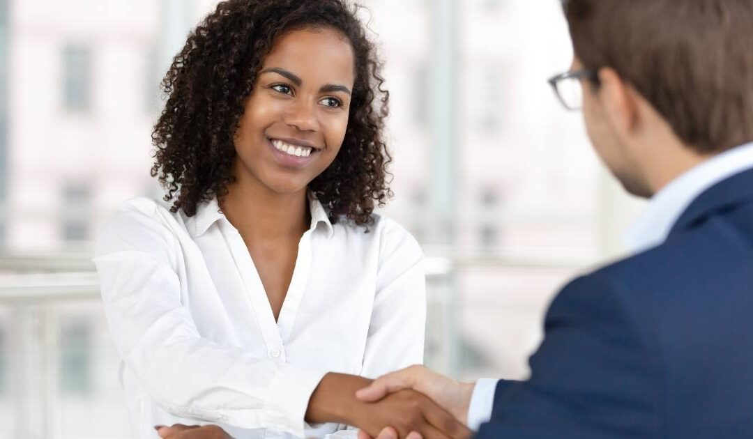 Woman interviewing a man for a job
