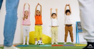 childcare director monitoring children playing a sport