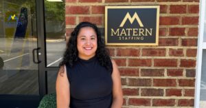 Maria standing outside near the Matern STaffing logo