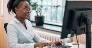 professional employee answering email and documenting processes