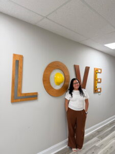 Maria in front of the love sign