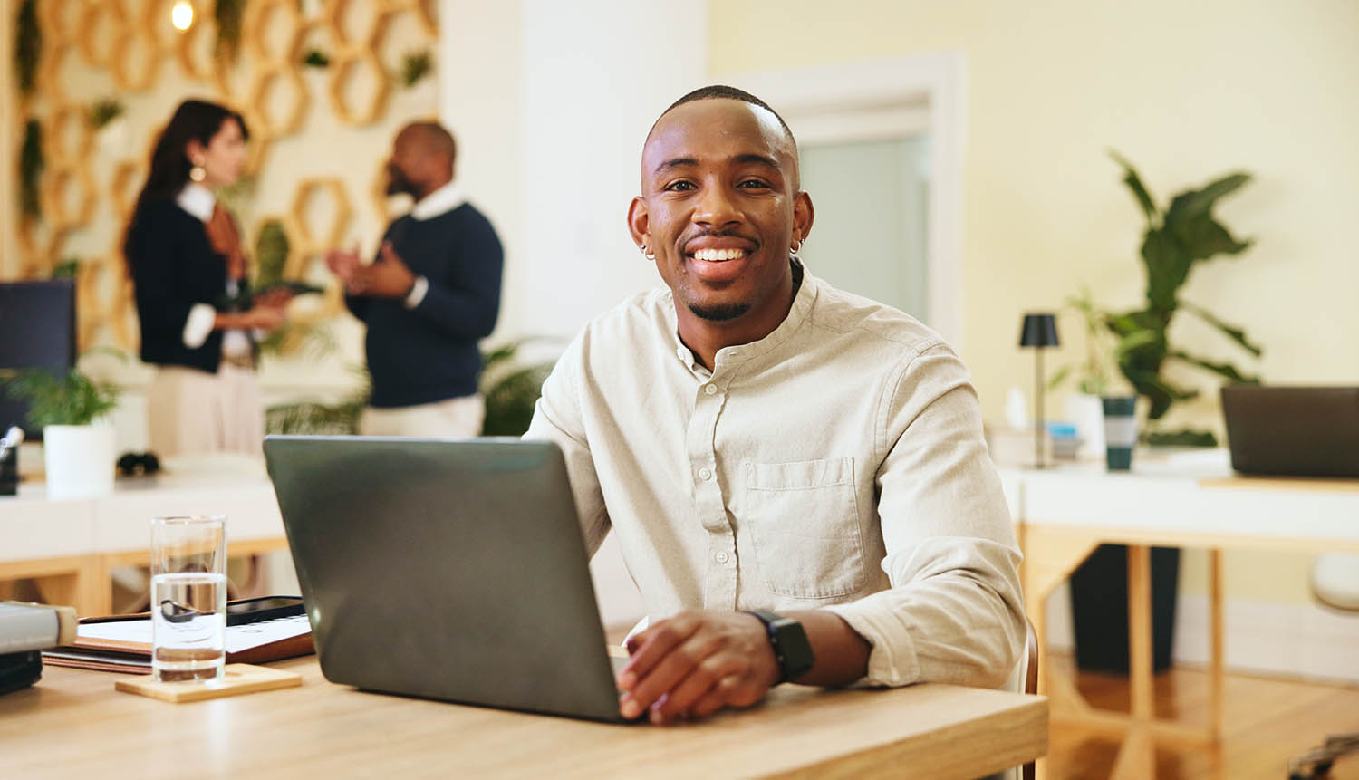 Happy man, portrait and office with laptop for administration Happy man, portrait and office with laptop for administration